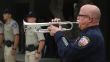 Lemoore Police Officer Tracy Landrus plays taps at Kings County's Peace Officer Memorial Wednesday at the Kings County Government Center.